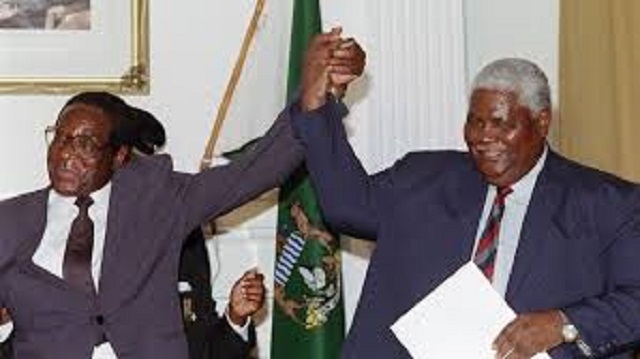 President Mugabe and the late Vice President Dr Joshua Mqabuko Nkomo after the signing of the Unity Accord