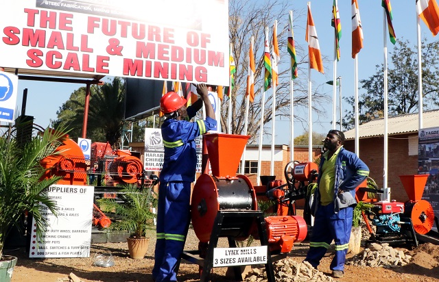 It's all system go . . . Yagden employees put up finishing touches at their stand ahead of this year's Mine Entra which started yesterday. (Picture by Eliah Saushoma)