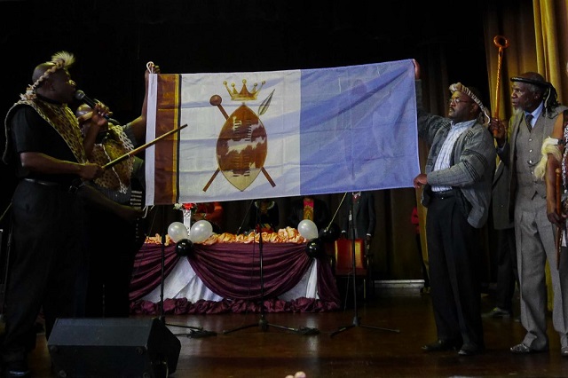 Stanley Raphael Khumalo, who says is the next Ndebele King, unveiling the flag which he says must be hoisted all over Mthwakazi after his inauguration on 12 September when he officially starts his reign.
