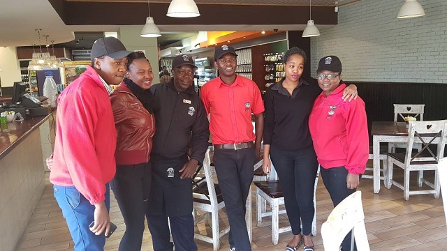Trinity Sibanda (second left), Zodwa Wabantu's Byo 'twin' with Food Lover's Market staff