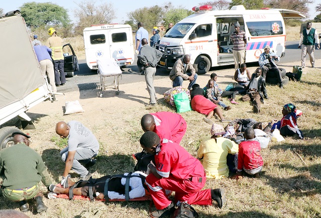 Emergency workers attend to the injured after the crash along Harare Road in Bulawayo
