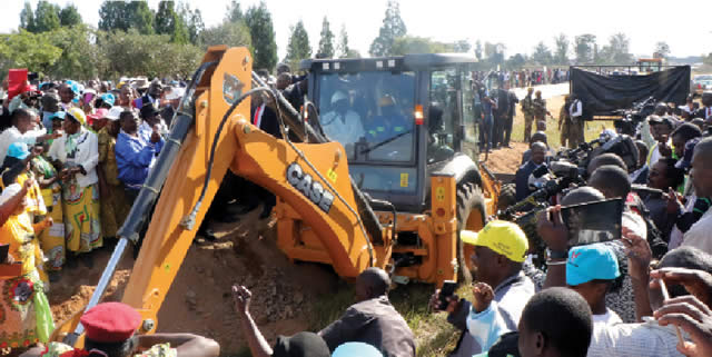 President Mugabe (inside the caterpillar) officially launches the dualisation of the Beitbridge-Harare and Harare-Chirundu highways at Chaka Business Centre in Chirumanzu along the Harare-Masvingo highway in this file photo