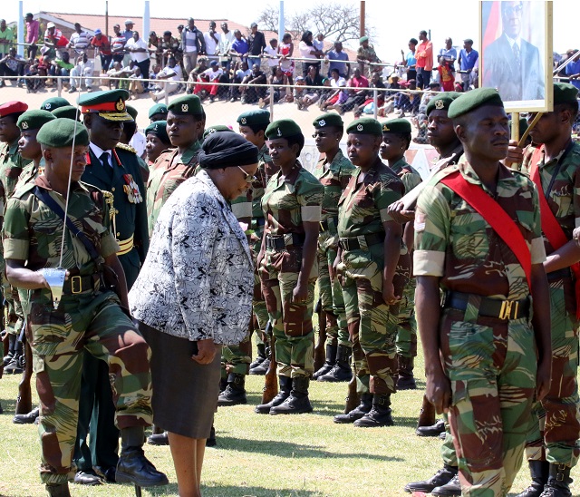 Minister of State for Bulawayo Provincial Affairs Cde Nomthandazo Eunice Moyo salutes the President's portrait during an inspection at the Defence Forces' Day celebrations parade at White City Stadium in Bulawayo yesterday