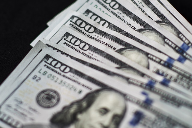 Yuan And Dollar Banknotes Ahead Of Tenth Anniversary Of China's Yuan Reform