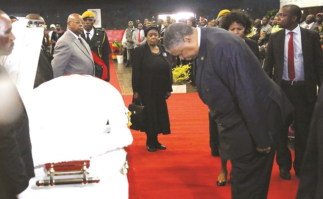 Vice President Phelekezela Mphoko pays his last respects during the funeral of national heroine Cde Shuvai Ben Mahofa in Harare yesterday