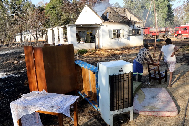 A raging veld fire swept through Cyrene High School yesterday and destroyed a teacher's cottage and property worth more than $40 000