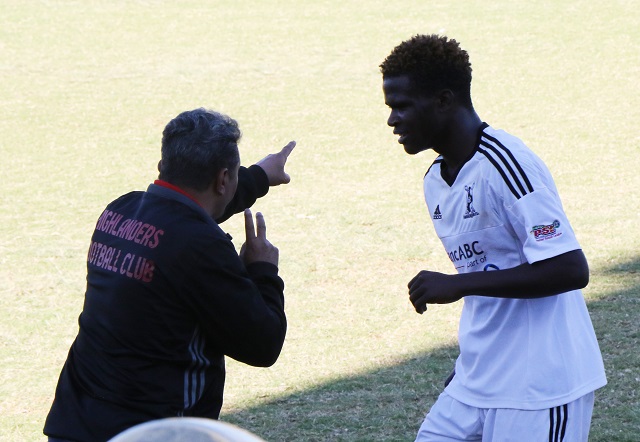 Akbay passes instructions on the touchline