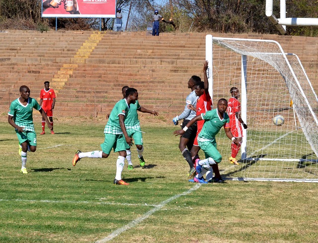 Hardlife Zvirekwi (right) wheels away in celebration after scoring Caps United's first goal