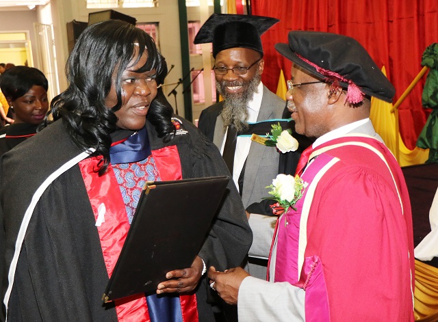 Ministry of Higher and Tertiary Education Permanent Secretary Professor Francis Gudyanga presents an ECD Diploma to Agnes Hadzizi while Bulawayo Polytechnic Principal, Engineer Gilbert Mabasa looks on during a graduation ceremony on Friday