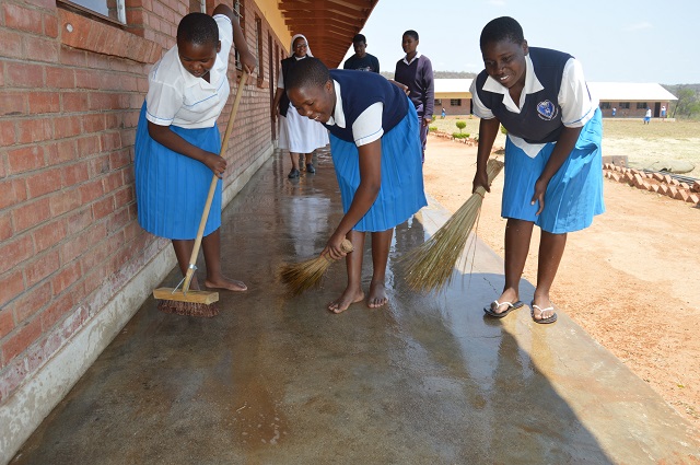 Sacred Heart pupils clean their classrooms