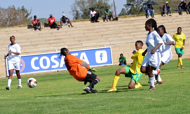 Chantelle Esau (third from left, No 9) of South Africa slots the ball home past Lesotho goalkeeper during a Cosafa women's championship match at Luveve Stadium in Bulawayo yesterday. — (Picture by Obey Sibanda)