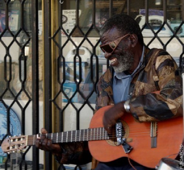 The ever smiling Tafi Dube strumming his guitar