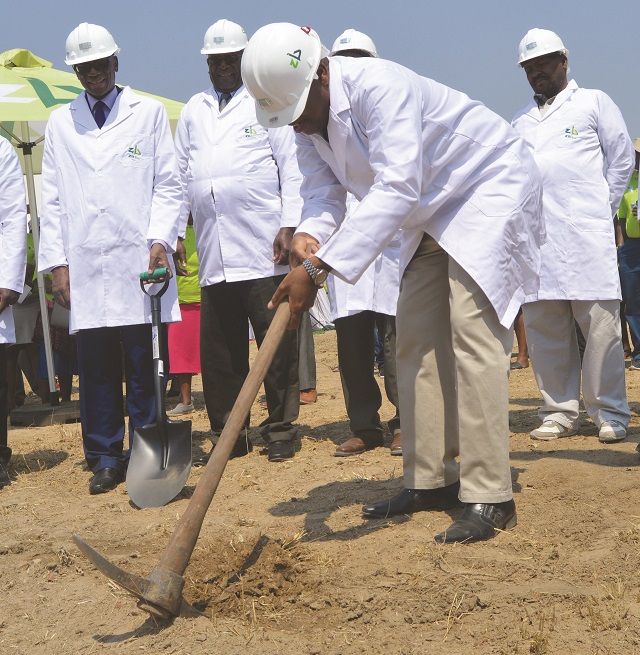 Plumtree Town secretary Mr Davis Luthe digs to mark the ground breaking ceremony by ZB bank to build medium and high density houses in Plumtree town on Saturday. On the left is the ZB bank group CEO Mr Ron Mutandagayi (holding a shovel), Mangwe District Council chairman Mr Mafesi Ncube and the district administrator Mr John brown Ncube on the right. — Picture by Dennis Mudzamiri
