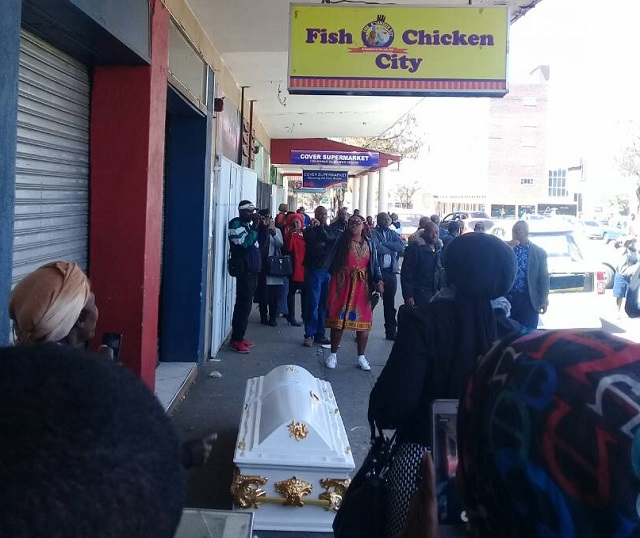 Tawanda "Mapecca" Moyo's coffin at his alleged killer's shop in the city centre