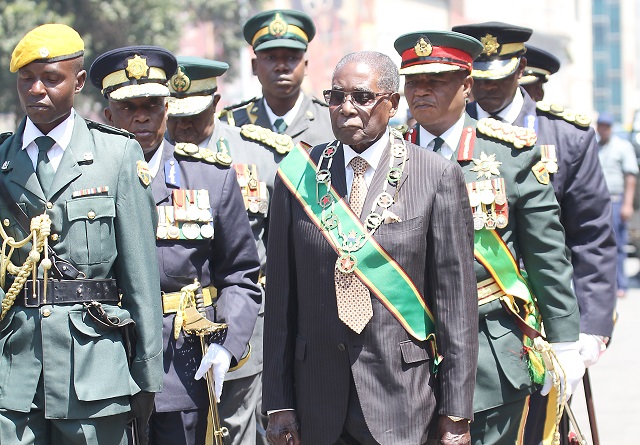 President Mugabe arrives for the opening of Parliament in Harare yesterday