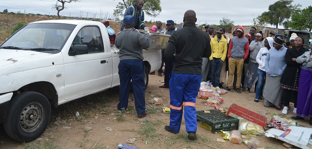 The crash vehicle being towed away (top) and police collecting the body in Cowdray Pak, Bulawayo, yesterday