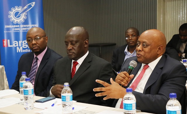 Zimpapers (1980) Limited Board Chair Mr Delma Lupepe addresses the Business Chronicle Pre-Budget dialogue at a Bulawayo hotel yesterday. Listening (from left) are Group Human Resources manager Mr Herbert Simemeza and General Manager of the Group's Digital and Publishing Division Mr Marks Shayamano