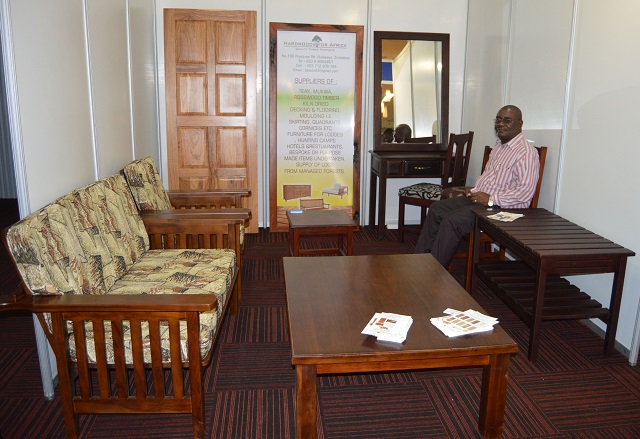 Mr Peter Marume of Hardwoods for Africa displays some of the products they make which include doors, coffee tables, sofa frames and bedroom suites, among others at their stand during the Home Building and Construction Expo hosted by the Rainbow Tourism Group at Rainbow hotel last week