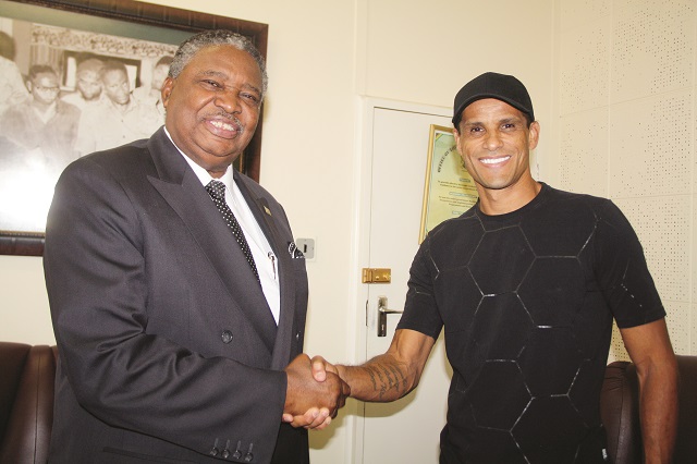 Acting President Phelekezela Mphoko welcomes the visiting Brazilian legend Vitor Borba Ferrera also known as Rivaldo at his Munhumutapa offices in Harare yesterday. — Picture by Shelton Muchena