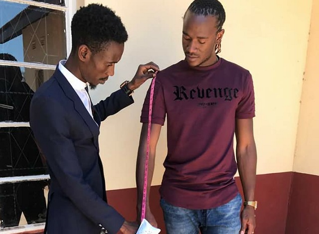 Thembani Mubochwa fits out Jah Prayzah recently