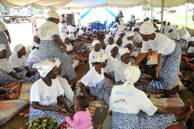 Members of the Women in Peacebuilding Network (WIPNET) sit on mattresses under a tent as they fast. Their call for peaceful elections next week is an echo of the non-violent protests by female activists that famously helped to end Liberia's civil wars. — AFP