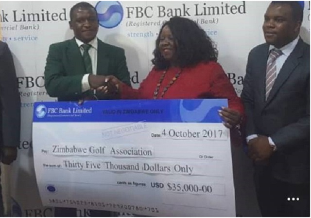 ZGA president Mufaro Chivonivoni (left) receives a $35 000 cheque from the FBC head of marketing Priscilla Sadomba in Harare on Wednesday. On the right is the bank's brand manager Roy Nyakunuwa.