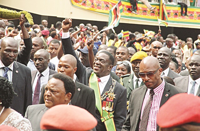 President waves to the crowd at the stadium.