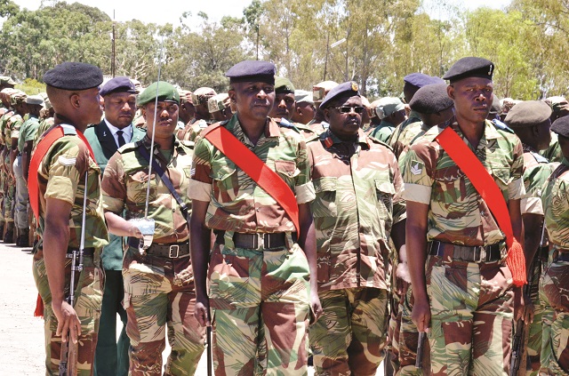 Bulawayo District Commander Colonel Rantham Moyo (in spectacles) inspects the parade at Imbizo barracks yesterday