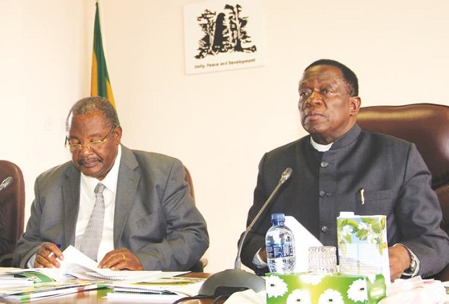 President Emmerson Mnangagwa (right) flanked by Minister Obert Mpofu at the Politburo meeting in Harare yesterday