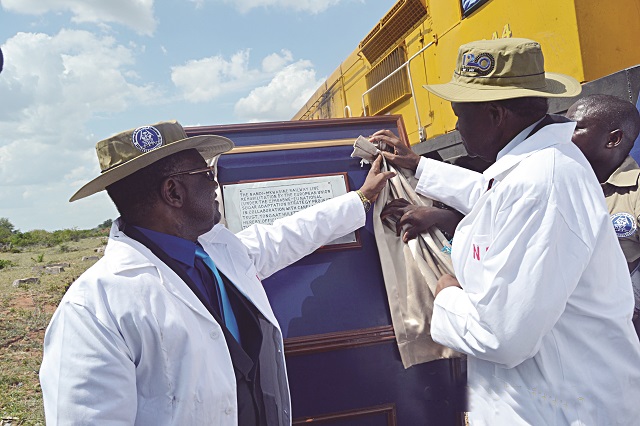 The Minister and Masvingo Minister of State for Provisional Affairs Senator Josiah Hungwe unveil a plaque to commission the project