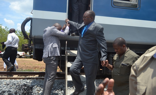 Transport and Infrastructural Development Minister Dr Joram Gumbo disembarks from a passenger train before commissioning the Nandi-Mkwasine railway line in Chiredzi yesterday.