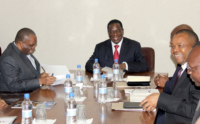 President Emmerson Mnangagwa shares a lighter moment with Afreximbank officials and Reserve Bank governor Dr John Mangudya in Harare yesterday